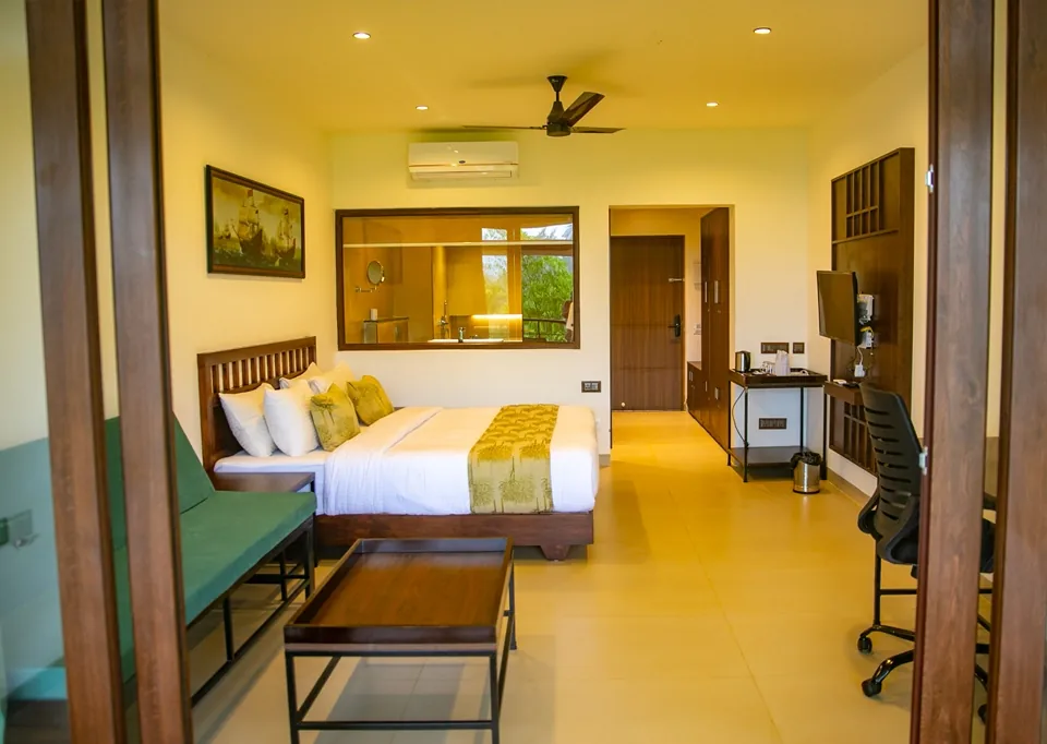 Spacious Deluxe King Room overlooking lush Wayanad plantations