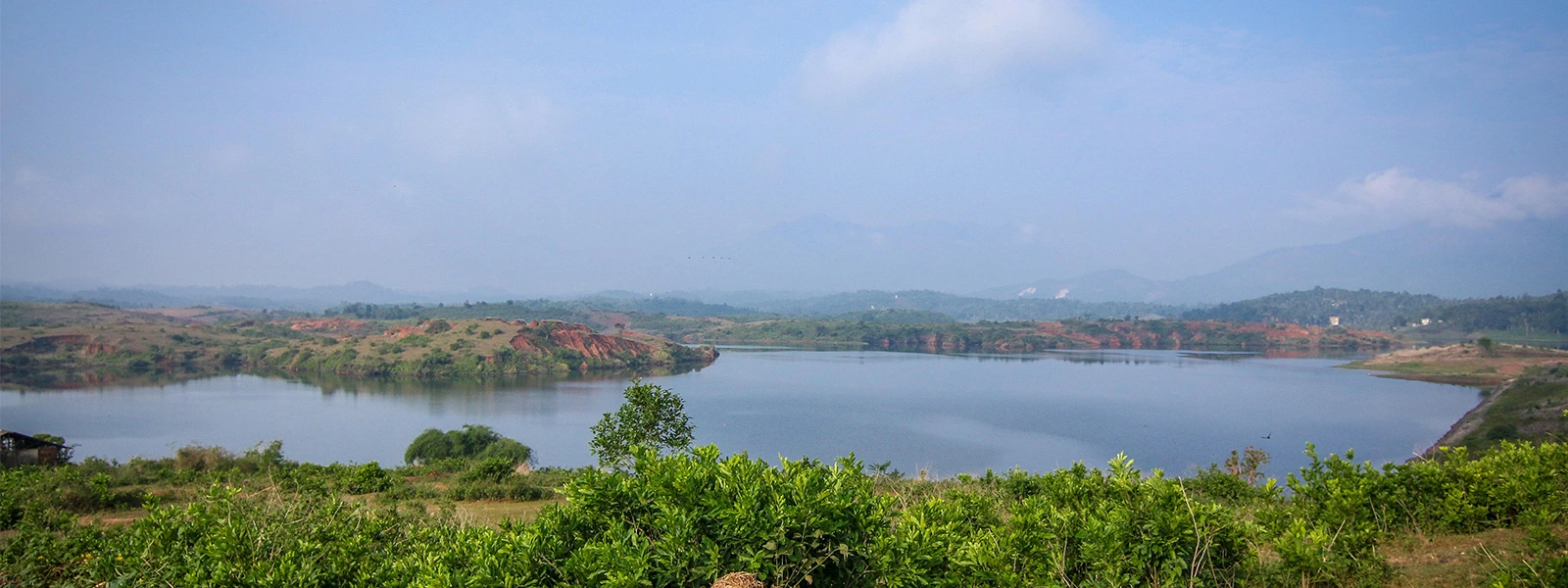 Karapuzha Dam surrounded by lush greenery in Wayanad